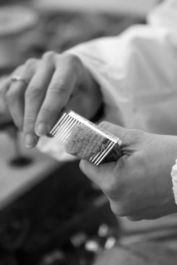 The fibres are given an initial brushing to perfectly align them to display the characteristic colors and bands of each type.