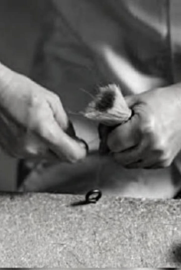 Following the brushing and arranging, artisans tie each the knot by hand using the same techniques as have been used for over 100 years.
